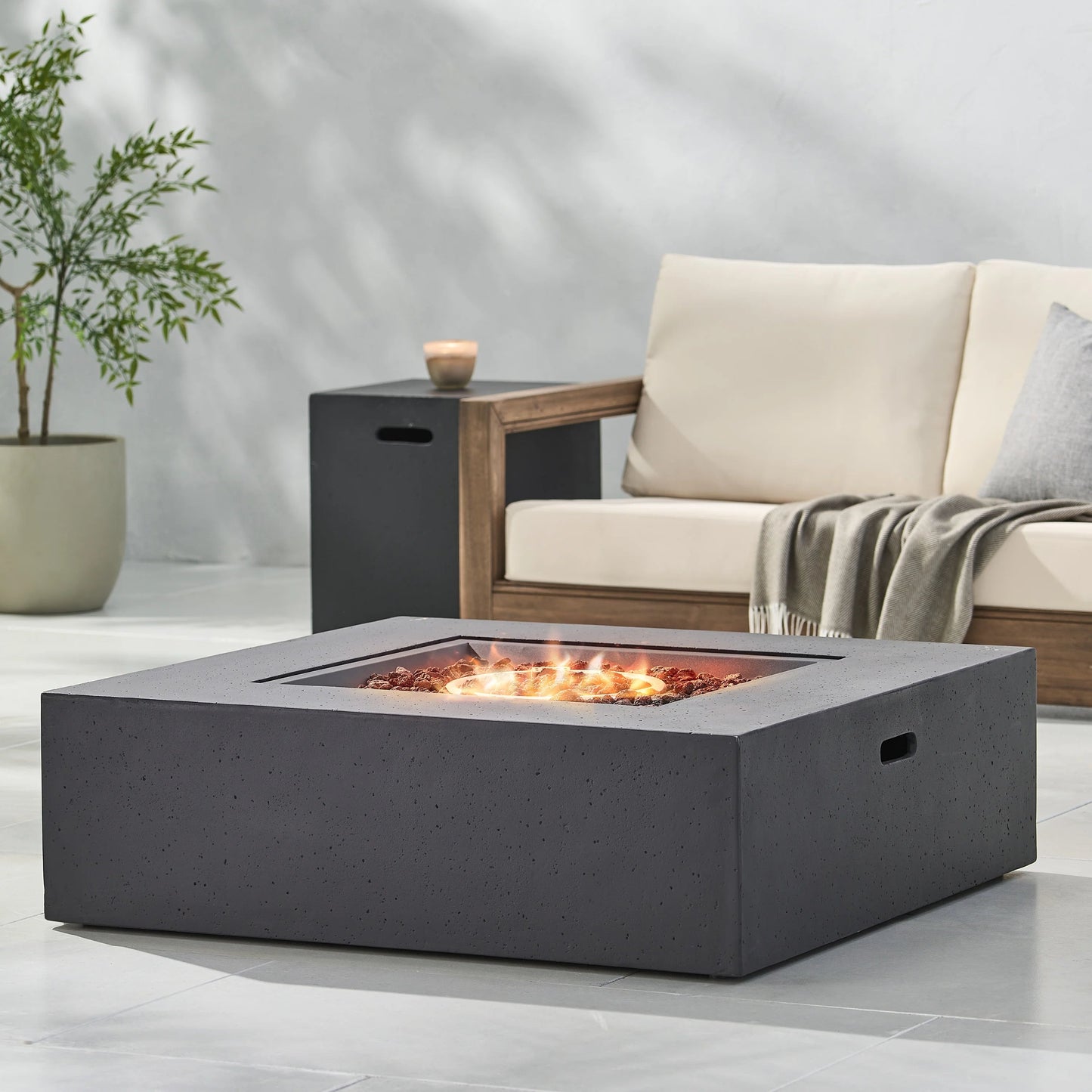 Outdoor fire pit 50000 BTU propane, dark grey with tank holder, glowing embers on Tampa Home & Garden Store