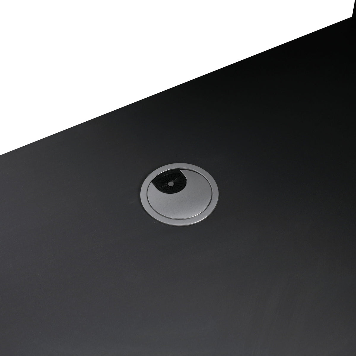 Vanity sink drain close-up on dark countertop with silver circular stainless-steel surround on Tampa Home & Garden Store