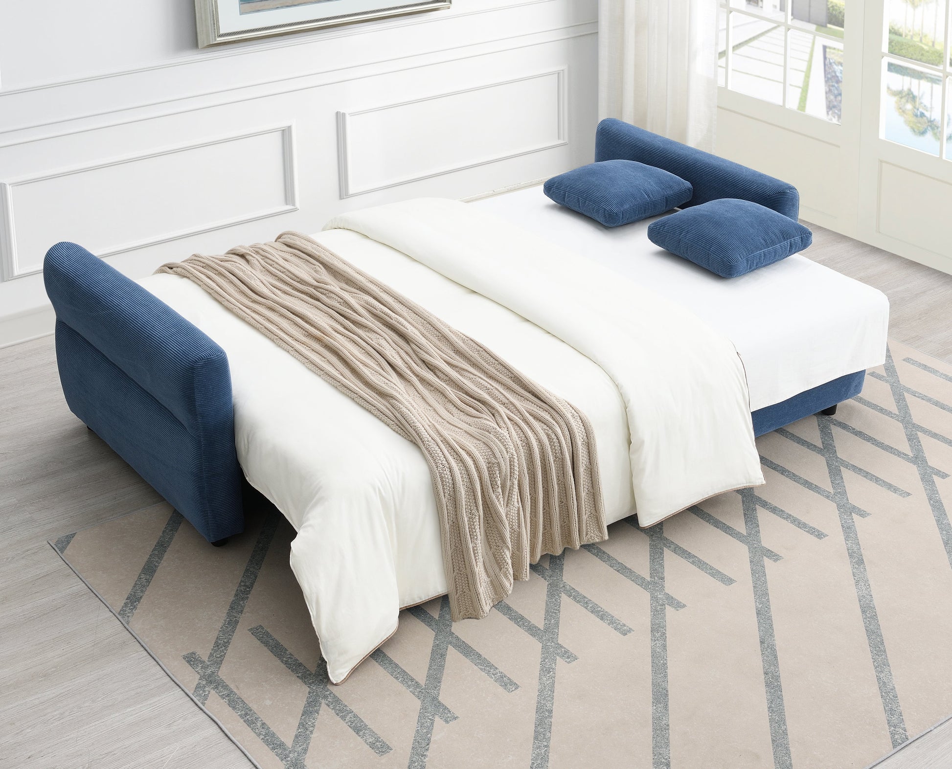 Haran Fabric Pull-Out Sleeper with Storage bed in blue upholstery, white bedding, blue cushions on Tampa Home & Garden Store