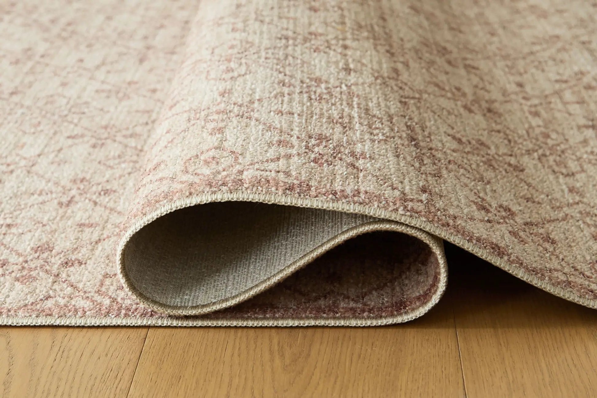 Lyamford rug, beige pink patterned area rug by Unique Piece Furniture, rolled edge on Tampa Home & Garden Store