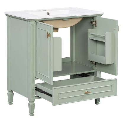 Freestanding vanity with white sink in sage green cabinet, doors, drawer, and soft-close hinges on Tampa Home & Garden Store
