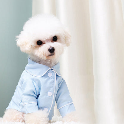 Pet Zen dog pajamas, light blue jacket with white snaps on a fluffy small dog on Tampa Home & Garden Store