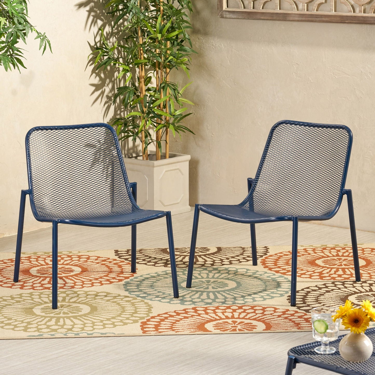 Pair of Kincaid stackable iron armless outdoor chairs in navy blue mesh seats on Tampa Home & Garden Store