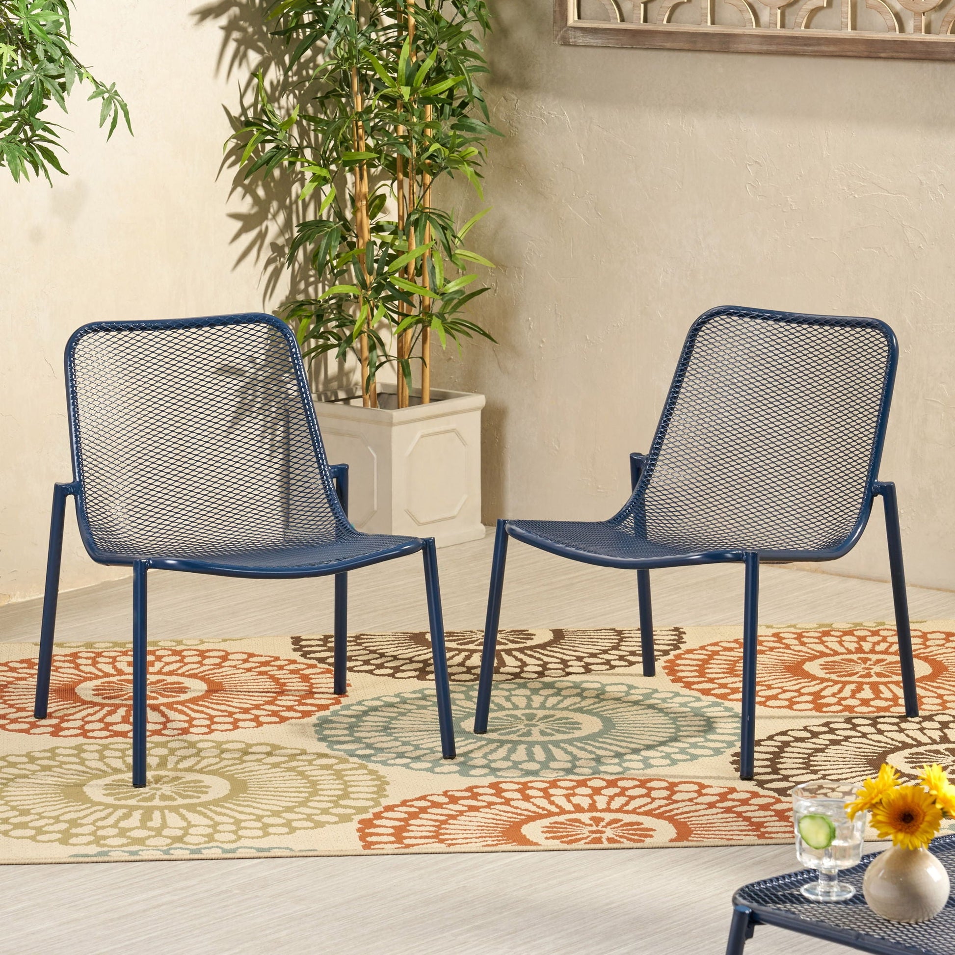 Pair of Kincaid stackable iron armless outdoor chairs in navy blue mesh seats on Tampa Home & Garden Store