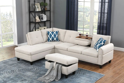 Alger beige fabric sofa with chaise and ottoman, blue geometric pillows, nailhead trim on Tampa Home & Garden Store