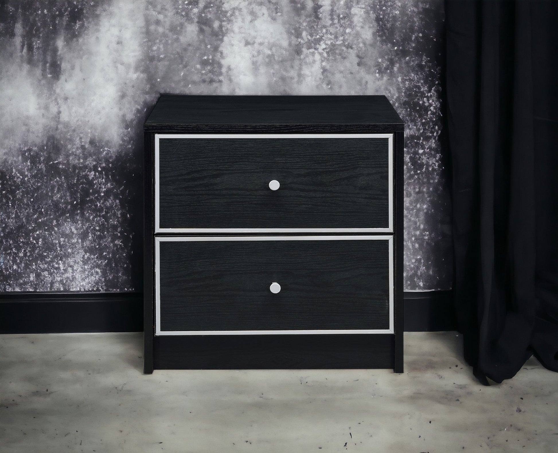 Modern black nightstand with three drawers, silver framed fronts and round metal knobs on Tampa Home & Garden Store