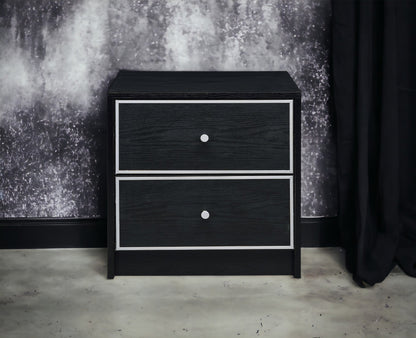 Modern black nightstand with three drawers, silver framed fronts and round metal knobs on Tampa Home & Garden Store