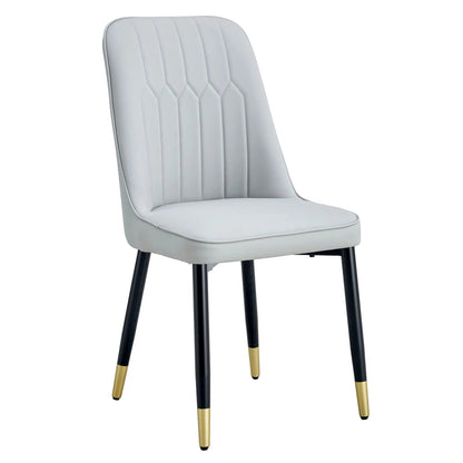 Modern chair with metal legs, light gray upholstery, black legs with gold tips on Tampa Home & Garden Store