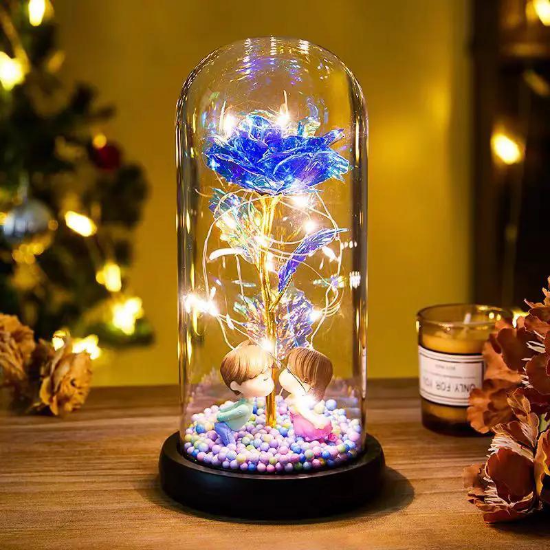 Eternal Rose LED foil flower under glass dome with blue bloom and warm LEDs, kissing figurines on Tampa Home & Garden Store