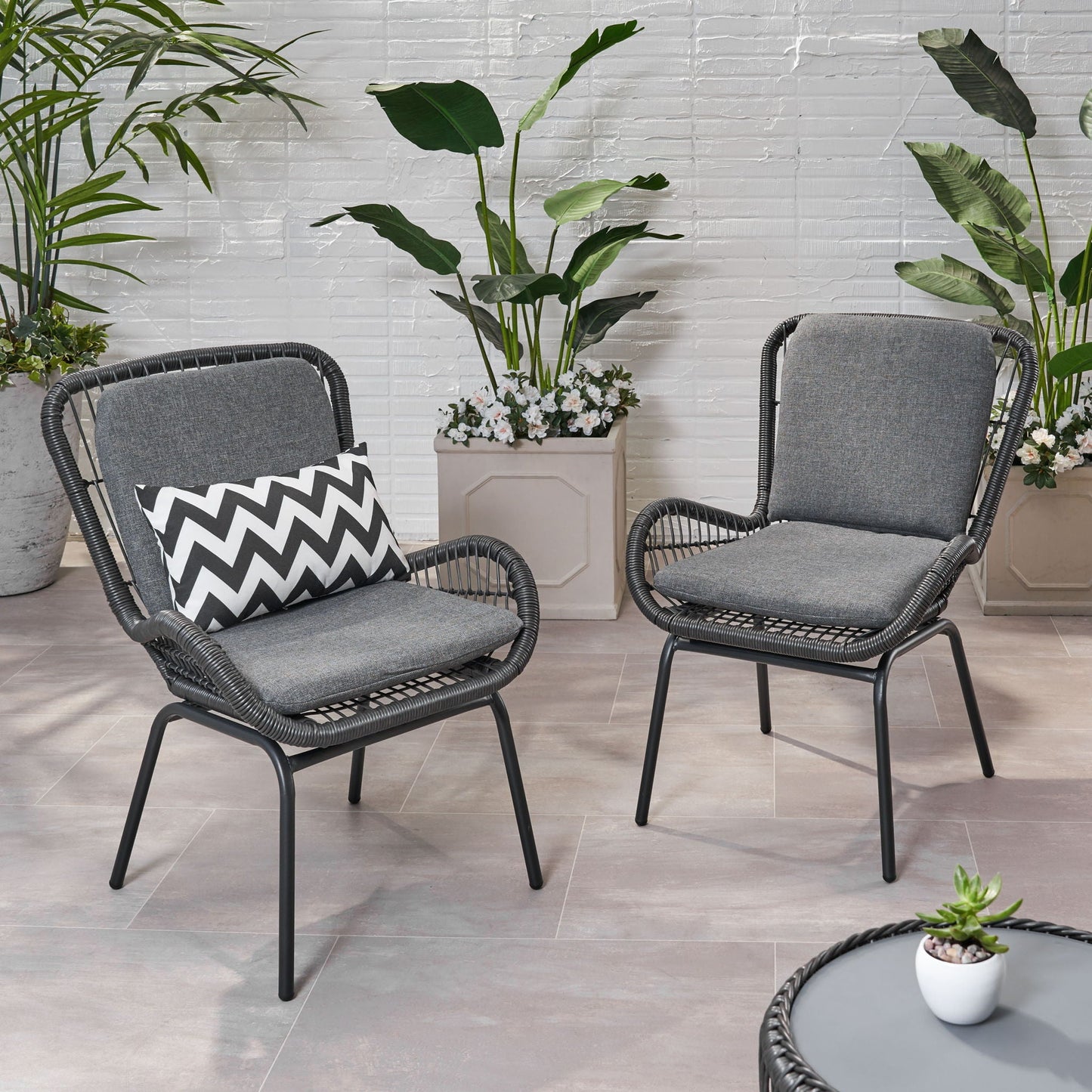 Outdoor wicker club chairs with grey cushions set of 2, left chair with a zigzag pillow on Tampa Home & Garden Store