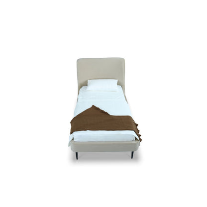 Heather upholstered bed with curved beige headboard, white bedding and brown knit throw on Tampa Home & Garden Store