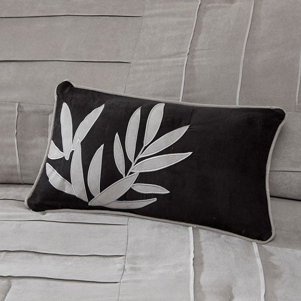 Throw pillow HouseOfZazla, black faux suede with gray leaf embroidery on a grey sofa on Tampa Home & Garden Store
