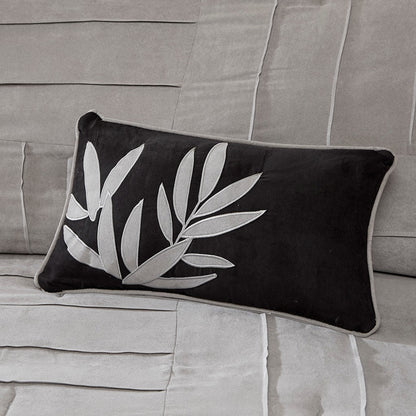 Throw pillow HouseOfZazla, black faux suede with gray leaf embroidery on a grey sofa on Tampa Home & Garden Store