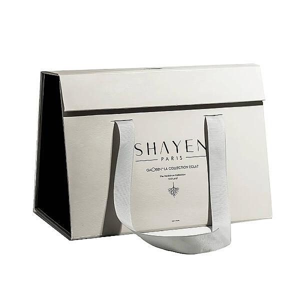 Shayen Paris Gaoben Collection Eclat Revitalizing Skincare Set in white gift bag with gray handles on Tampa Home & Garden Store