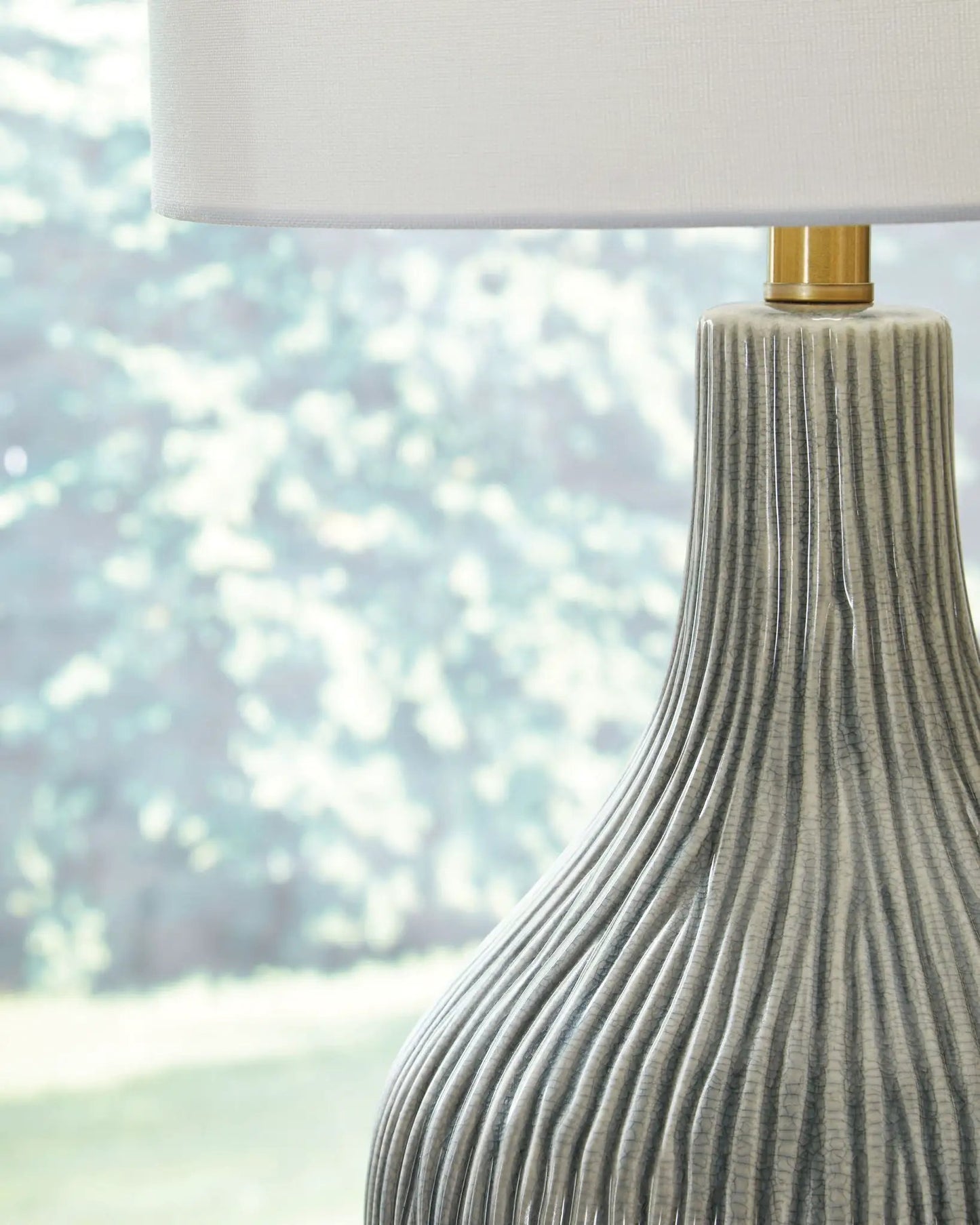 Judlen ceramic table lamp gray/gold finish with ribbed gray ceramic base and white fabric shade on Tampa Home & Garden Store