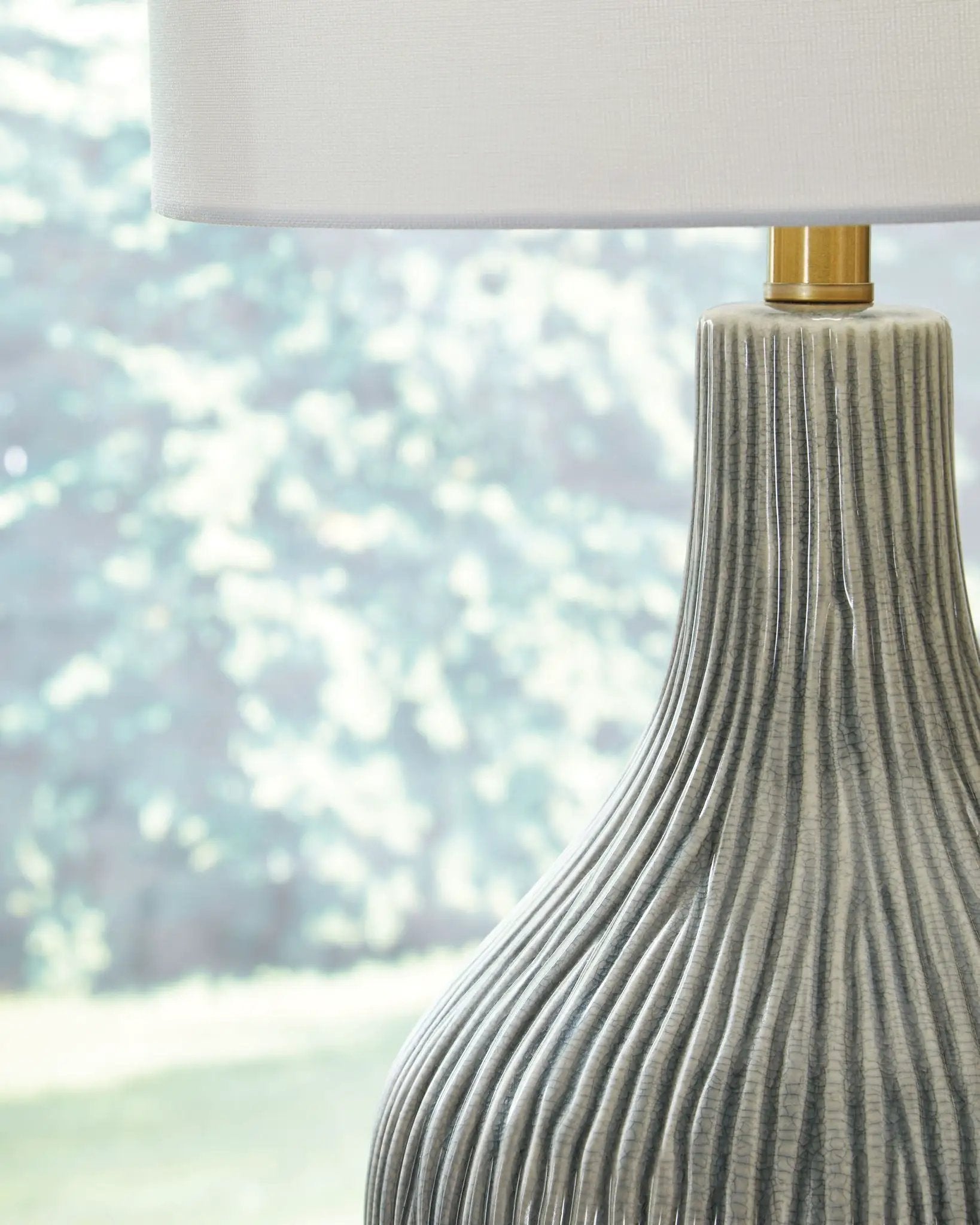 Judlen ceramic table lamp gray/gold finish with ribbed gray ceramic base and white fabric shade on Tampa Home & Garden Store