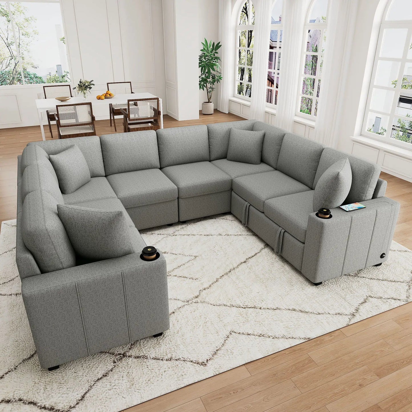 Modern U-Shaped Sectional Sofa in gray fabric with cup holders in a bright living room on Tampa Home & Garden Store