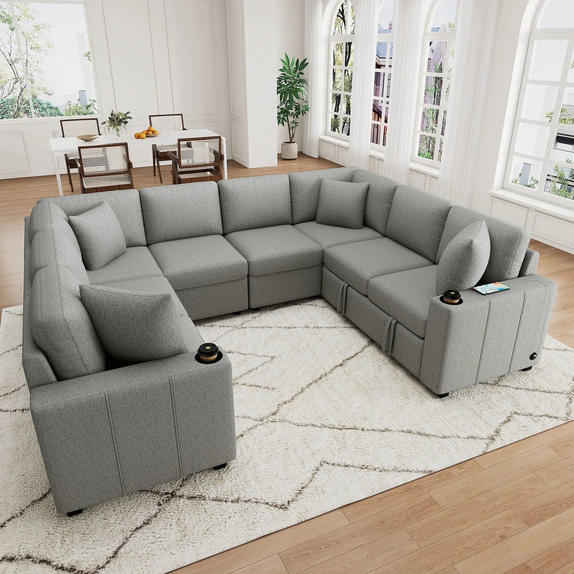 Modern U-Shaped Sectional Sofa in gray fabric with cup holders in a bright living room on Tampa Home & Garden Store