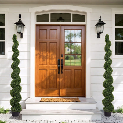 Two artificial UV resistant boxwood spiral topiary trees, green, flanking a door HouseOfZazla on Tampa Home & Garden Store