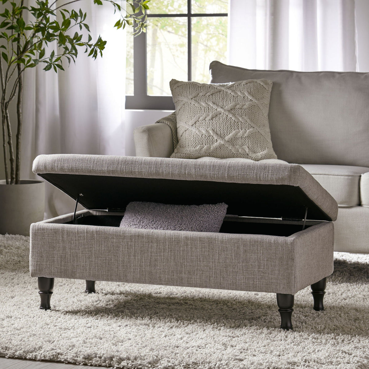Wide tufted rectangle fabric storage ottoman in gray with concealed storage and open lid on Tampa Home & Garden Store