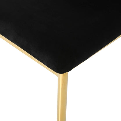 Modern dining chair with black upholstery and gold legs on Tampa Home & Garden Store
