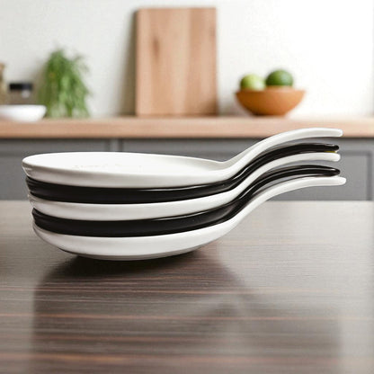 Spoon rests Gia Roma white ceramic with black bands stacked five deep on kitchen table on Tampa Home & Garden Store