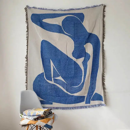 Blue Geometric Knitted Throw by Decorbites with fringed edges displayed on wall on Tampa Home & Garden Store