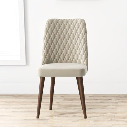 Mid-Century Modern dining chair with beige quilted back and upholstered seat, wooden legs on Tampa Home & Garden Store