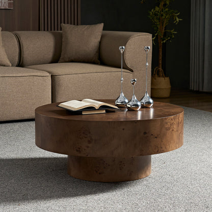 31.49in burl wood veneer round coffee table; book and silver candlesticks on table on Tampa Home & Garden Store