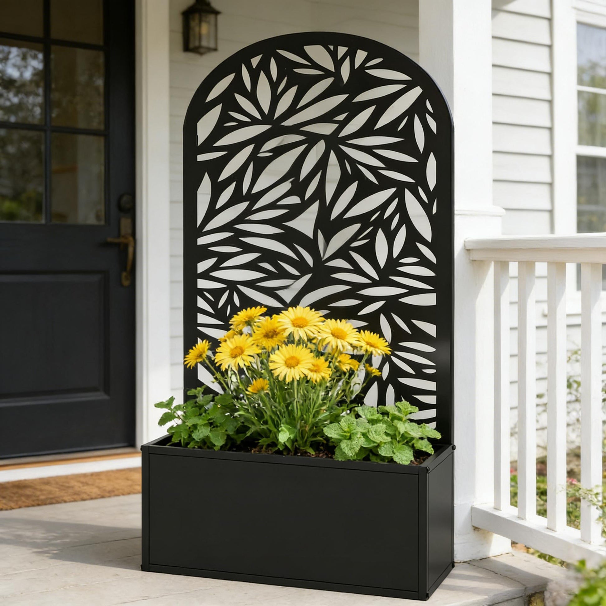 Curved raised garden bed by HouseOfZazla with black leaf-pattern metal panel planter box on Tampa Home & Garden Store