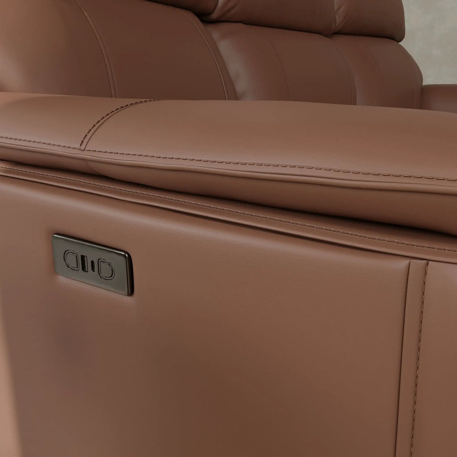 Oslo dual power reclining sofa tan leather with stitched panels and Uniq logo on Tampa Home & Garden Store