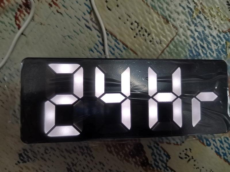 Acrylic mirror LED alarm clock with white seven-seg digits on a black panel by Stevvex on Tampa Home & Garden Store