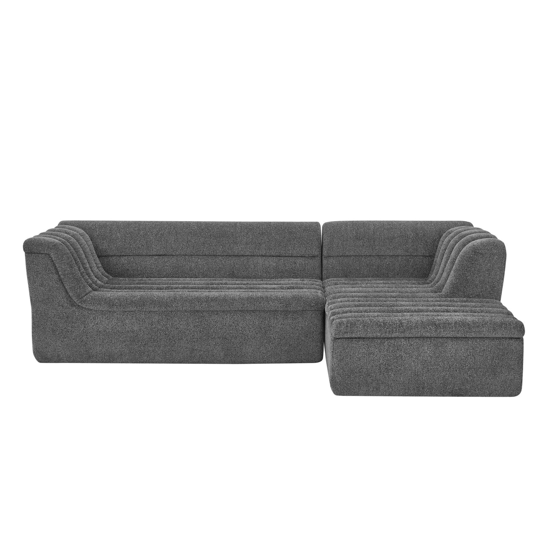 Upholstered L-shaped sectional sofa with chaise in dark gray fabric and wave-shaped arms on Tampa Home & Garden Store