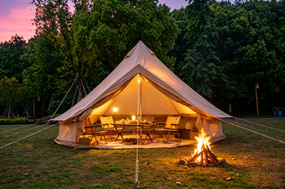 Oxford Bell Tent by HouseOfZazla with warm glow and outdoor dining setup on Tampa Home & Garden Store