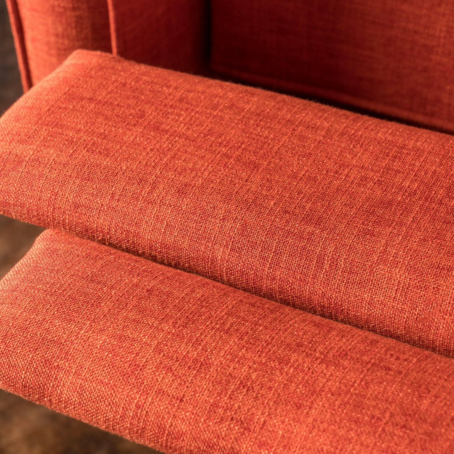 Mid-Century Modern Recliner upholstery close-up in warm red-orange woven fabric on Tampa Home & Garden Store