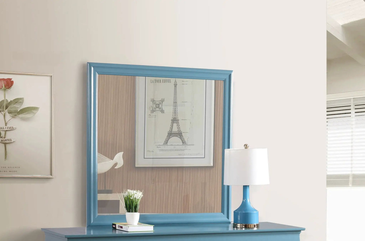 Blue framed wall mirror above blue console table with plant decor by Unique Piece Furniture on Tampa Home & Garden Store