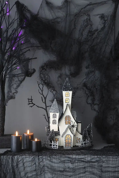 Cardboard Lighted Haunted House sculpture beige with glittery black roofs battery powered on Tampa Home & Garden Store