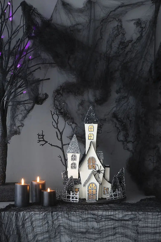 Cardboard Lighted Haunted House sculpture beige with glittery black roofs battery powered on Tampa Home & Garden Store