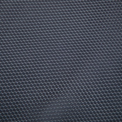 Luggage set fabric close-up in dark blue-gray with a circular dot texture on Tampa Home & Garden Store