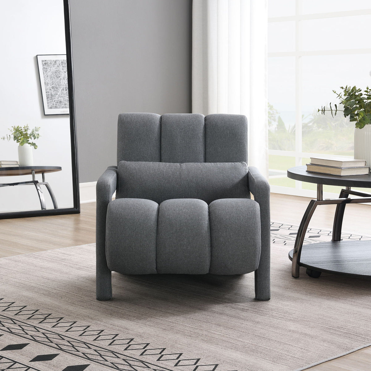 Accent chair in gray fabric upholstery with pillow and matching ottoman on Tampa Home & Garden Store