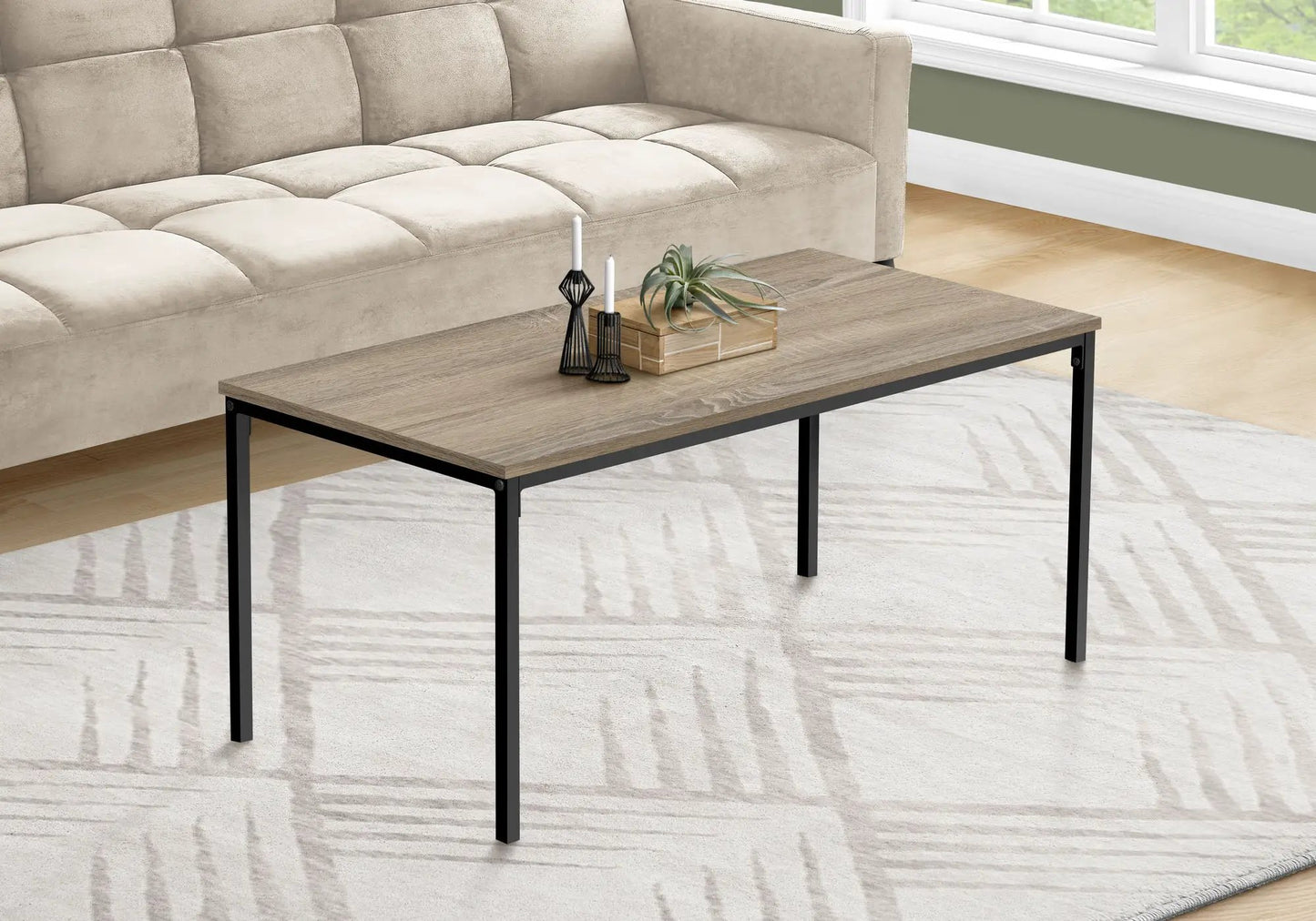 Rectangular coffee table with woodgrain top and black metal legs in a living room setting on Tampa Home & Garden Store