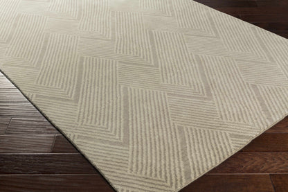 Adelanto Area Rug by Boutique Rugs, beige geometric striped pattern on dark hardwood floor on Tampa Home & Garden Store