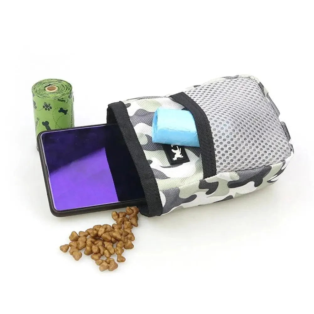 Stevvex adjustable camouflage dog treat pouch with waist belt, mesh pocket, phone, and scattered treats on Tampa Home & Garden Store