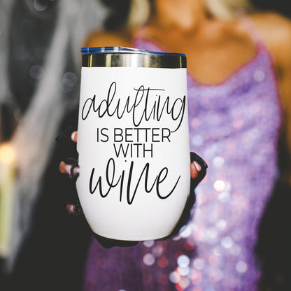 Gia Roma 17oz tumbler, white body with blue lid, features adulting is better with wine on Tampa Home & Garden Store