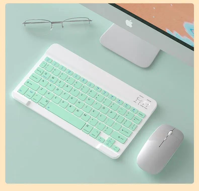 Wireless Mouse For Tablets And Laptops in silver beside mint keyboard (two items) on desk on Tampa Home & Garden Store