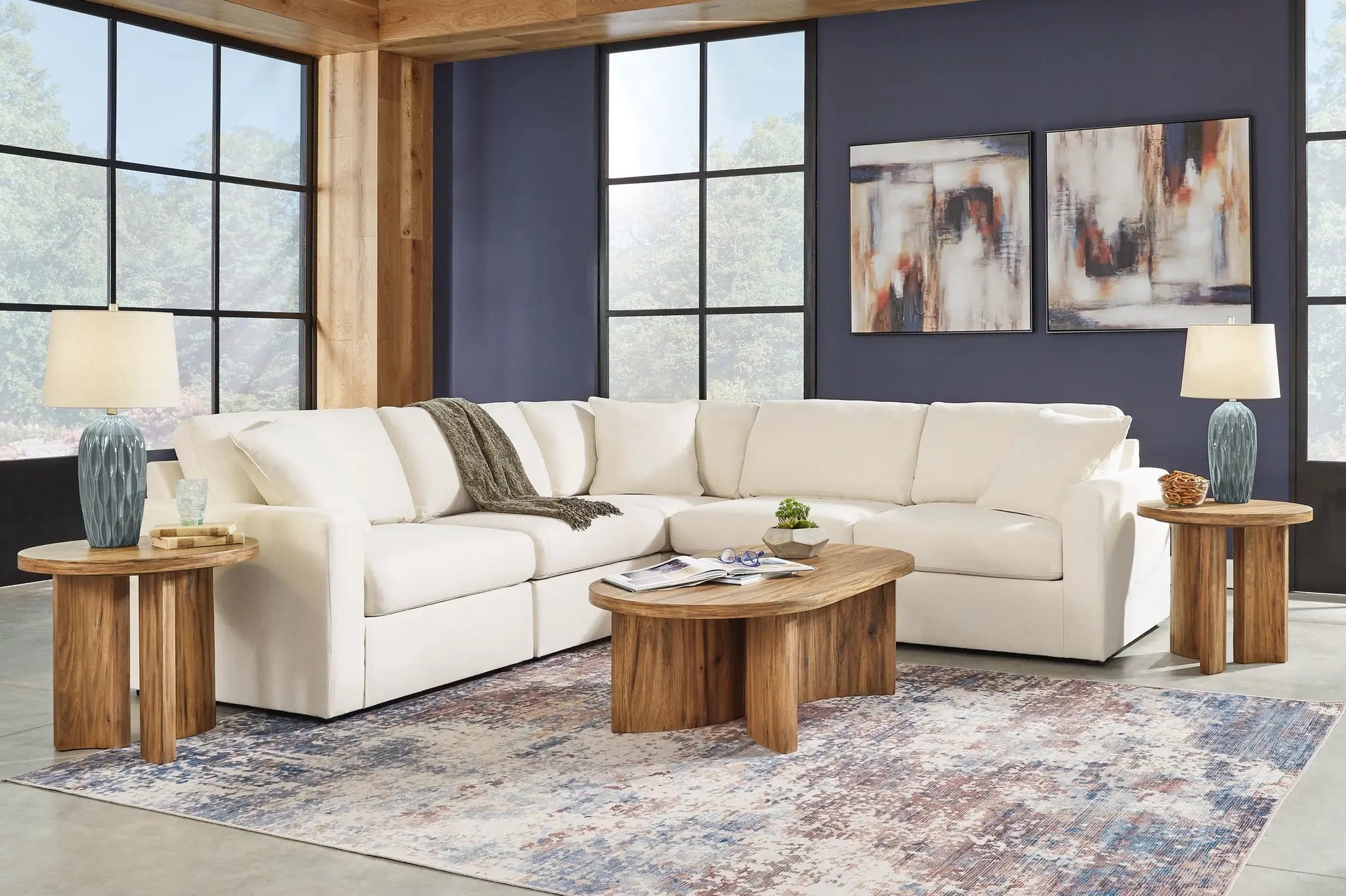 Modmax Sectional Oyster ivory fabric stationary sofa in a living room with dark blue wall on Tampa Home & Garden Store