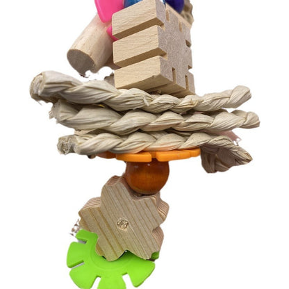 Parrot gnawing toy with braided rope, wooden blocks, orange ring, and green gear on Tampa Home & Garden Store