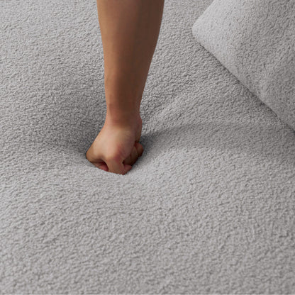 Curved 4 Seater Full Compression Sponge Sofa on gray carpet beside a gray sofa cushion on Tampa Home & Garden Store