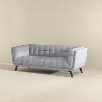 Addison mid-century tufted sofa in gray fabric with curved arms and tapered wooden legs on Tampa Home & Garden Store