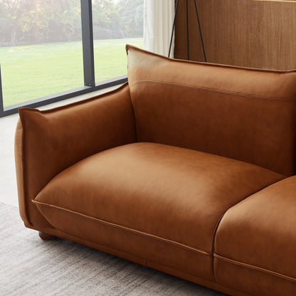 Mid-Century Modern brown leather sofa with visible stitching and curved arms on Tampa Home & Garden Store